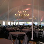 tent with elegant linens and chandeliers