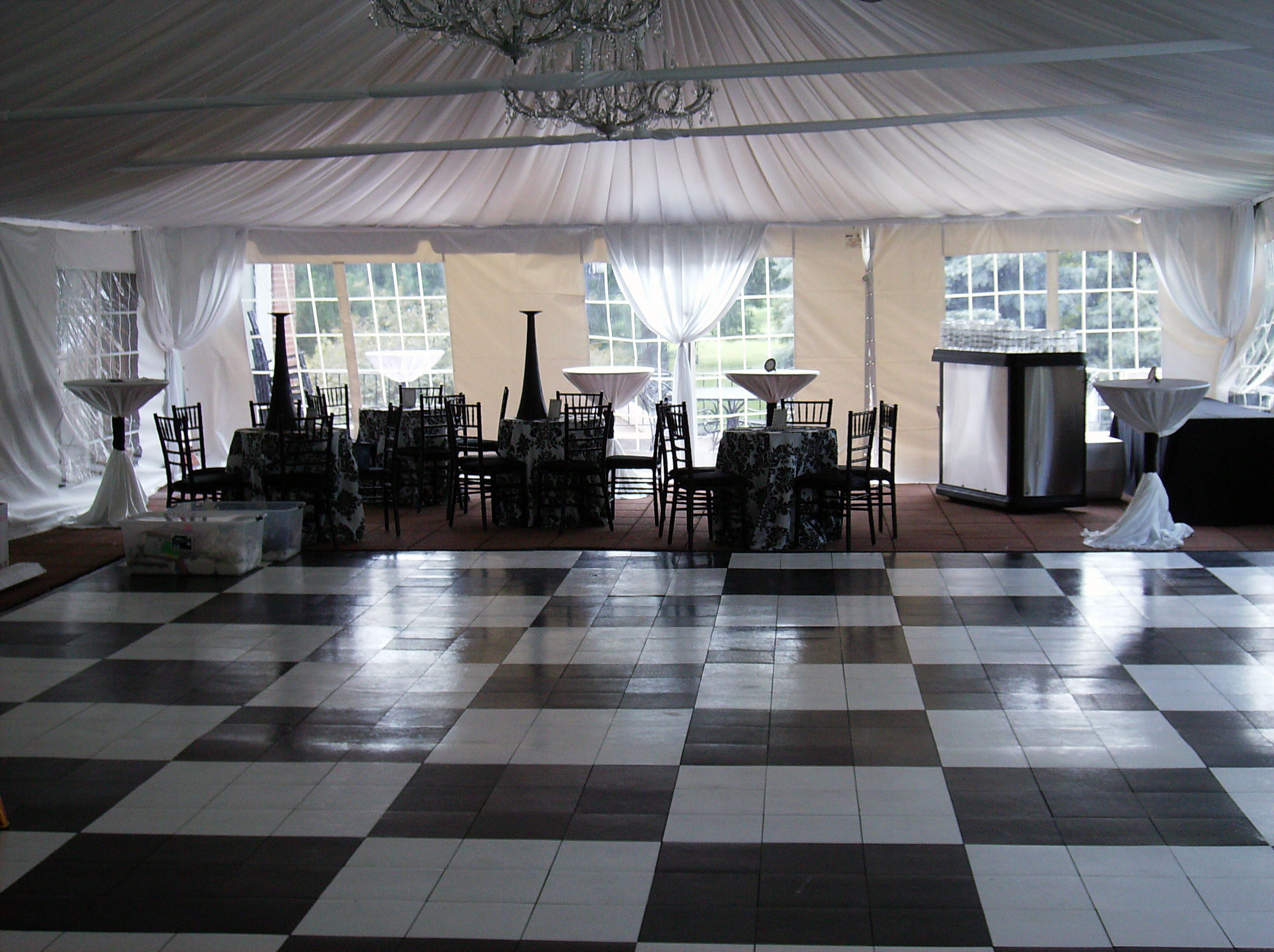 black and white floor in wedding tent