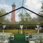 wedding ceremony with clear tent and altar