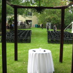 wedding ceremony with black chairs