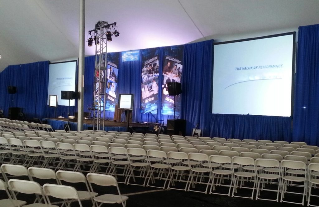 conference stage with large rental screen
