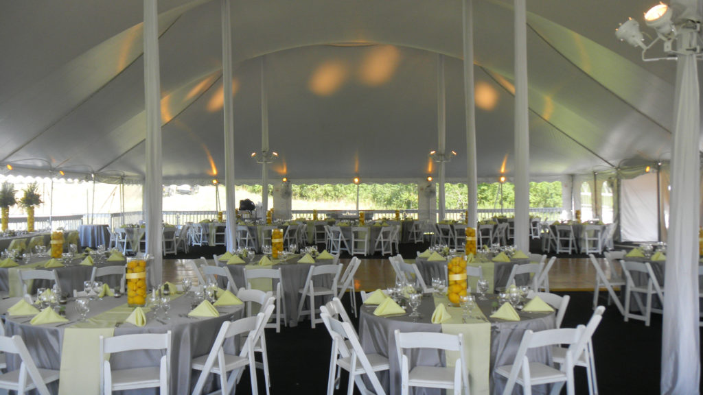 white tent with bright centerpieces