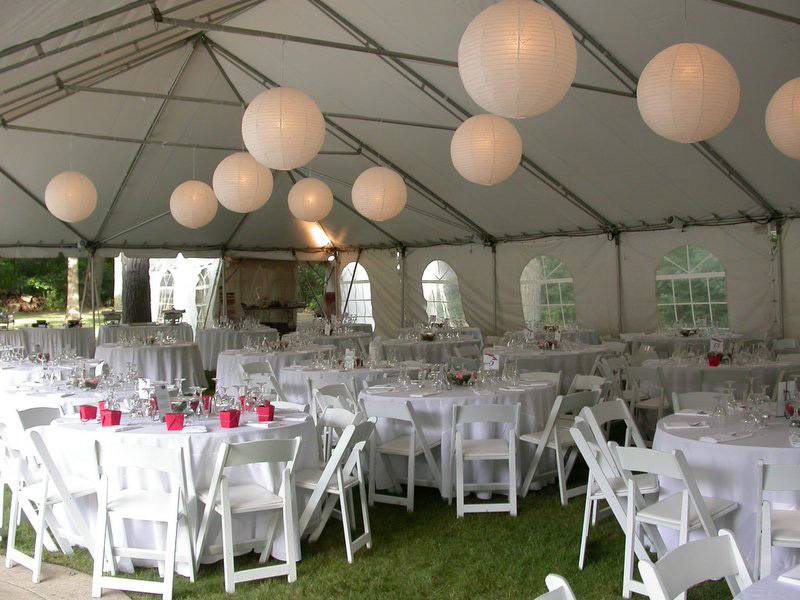 white paper lanterns in wedding tent with neutral wedding decor