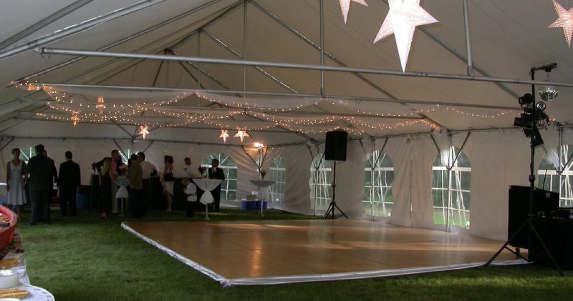 tent wedding with beautiful lights on ceiling